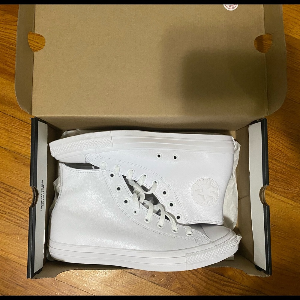 All white Hightop Converse